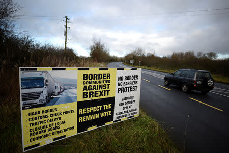 A sign from Border Communities Against Brexit is seen on the borderline between County Cavan in Ireland and County Fermanagh in Northern Ireland near Woodford, Ireland, November 30, 2017. REUTERS/Clodagh Kilcoyne/Files