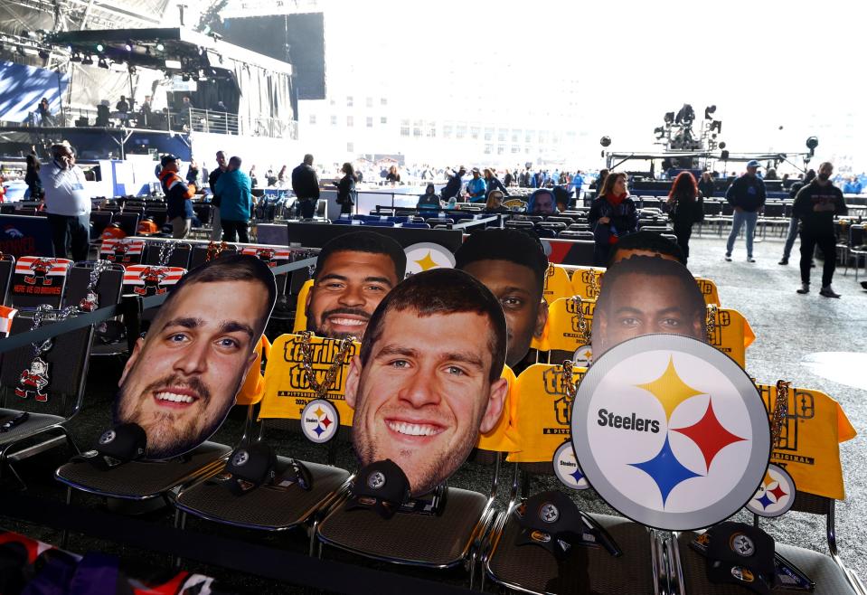 Oversize pictures of Pittsburgh Steelers players sit in the seats of Steeler fans who will be inside the NFL draft theater in the background before the start of the 2024 NFL draft in Detroit on Thursday, April 25, 2024.