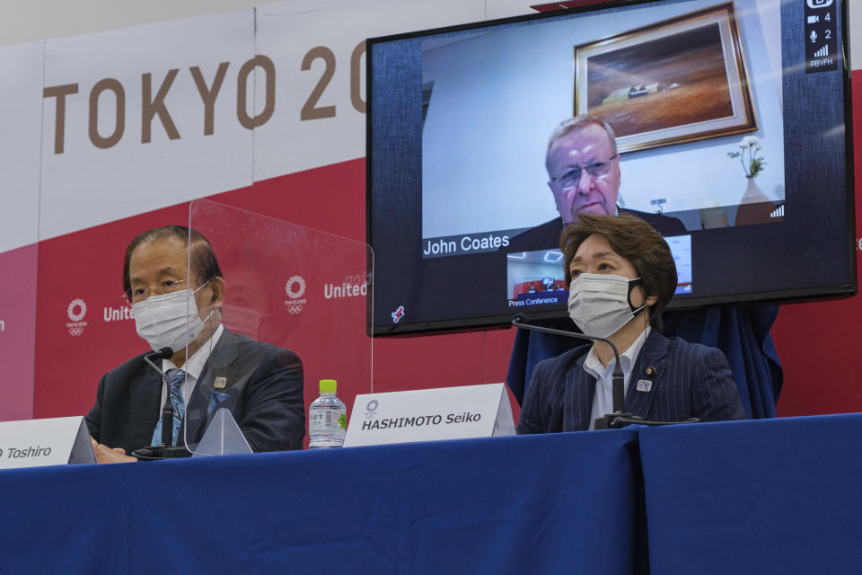 CEO of the Tokyo 2020 Toshiro Muto, left, Chairman of the Coordination Commission for the Games of the XXXII Olympiad Tokyo 2020 John Coates, (on screen) and President of the Tokyo 2020 Seiko Hashimoto, attend the Tokyo 2020 IOC Coordination Commission press conference on Friday, May 21, 2021 in Tokyo.(Nicolas Datiche/Pool Photo via AP)