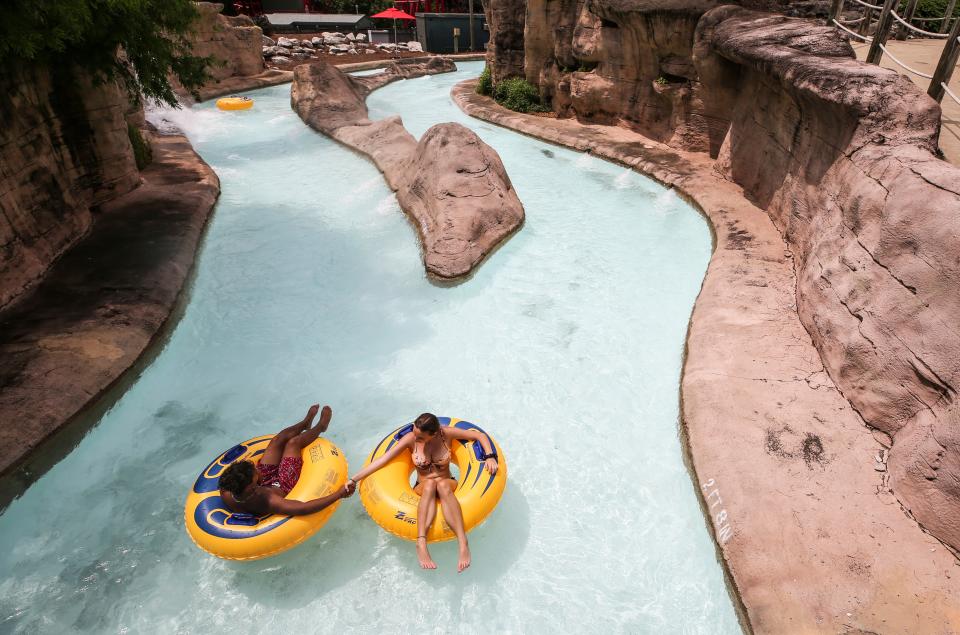 A couple float down Adventure River at the Hurricane Bay water park at Kentucky Kingdom  Monday on opening day. Parts of the water park still remain closed.  June 29, 2020