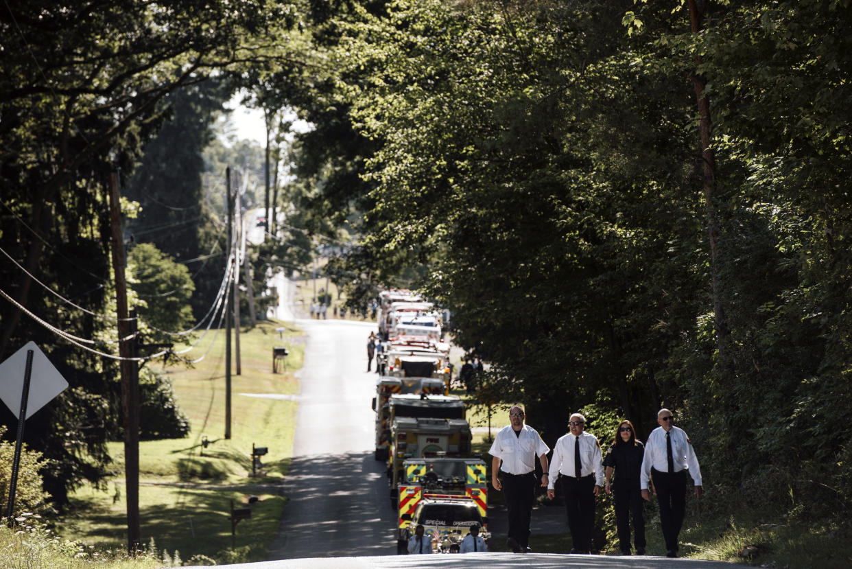 A group of first responders walks back from paying their respects during a final visitation at the Cabot United Methodist Church where the funeral service for Corey Comperatore, who was killed during the shooting at former President Donald Trump’s rally last Saturday, in Cabot, Pa., on Friday, July 19, 2024. (Kristian Thacker/The New York Times)
