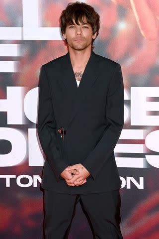 <p>Dave J Hogan/Getty </p> Louis Tomlinson at the U.K. premiere of 'All of Those Voices.'