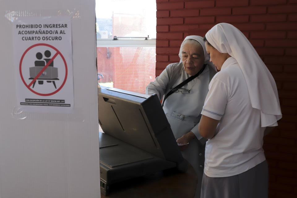 A nun votes at a polling station during general elections in Lambare, outskirts Asuncion, Sunday, April 30, 2023. (AP Photo/Marta Escurra)