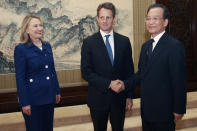 BEIJING, CHINA - MAY 3: U.S. Secretary of State Hillary Clinton (L) looks on as Treasury Secretary Timothy Geithner (2nd L) shakes hands with China's Premier Wen Jiabao during a meeting at the Zhongnanhai leadership compound on May 4, 2012 in Beijing. Hillary Clinton is in China for bilateral talks and has called on China to protect human rights. Chinese activist Chen Guangcheng has aksed to meet with the U.S Secretary of State to discuss his situation. (Photo by Shannon Stapleton/Pool/Getty Images)