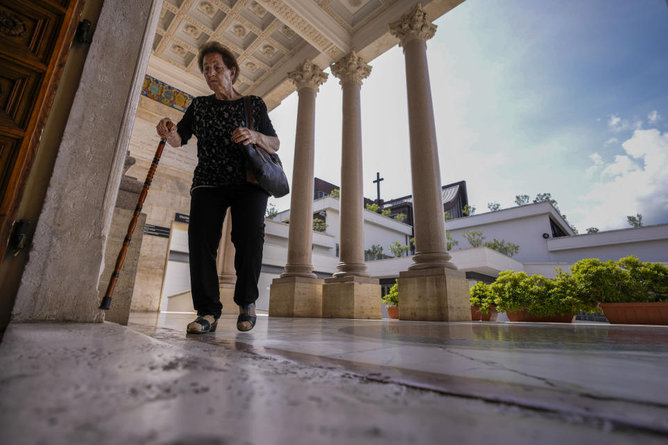 A woman arrives at the St. Gabriele dell'Addolorata sanctuary, near Teramo in Central Italy, Sunday, June 4, 2023. According to surveys, about 80% of Italians profess themselves Catholic – but only 19% attend services at least once a week while 31% never do. The Covid pandemic gave another "pruning" to "tepid Catholics," accelerating a loss in faith that started at least a generation ago, said Franco Garelli, a sociology professor at the University of Turin who's been studying religiosity in Italy for decades. (AP Photo/Domenico Stinellis)