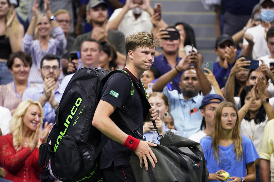 Jenson Brooksby, of the United States, heads off the court after losing to Novak Djokovic, of Serbia, during the fourth round of the US Open tennis championships, Monday, Sept. 6, 2021, in New York. (AP Photo/John Minchillo)