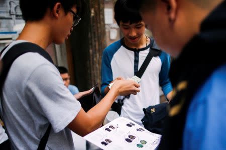 Shoppers buy and sell "The Life of Pablo" merch after visiting a pop up store featuring fashion by Kanye West in Manhattan, New York, U.S., August 19, 2016. REUTERS/Eduardo Munoz