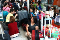 People wait with their luggage at Heathrow Terminal 5 in London, Britain May 27, 2017. REUTERS/Neil Hall