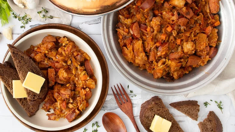 Meat and sausage sauerkraut stew with pumpernickel bread