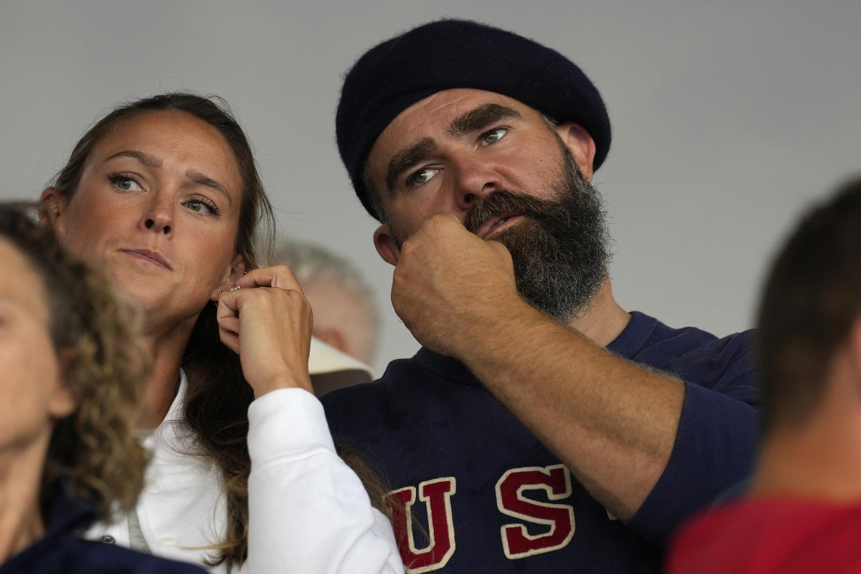 Former Philadelphia Eagles lineman Jason Kelce and wife Kylie watch the women's field hockey match between the Argentina and United States at the 2024 Summer Olympics. (AP Photo/Anjum Naveed)