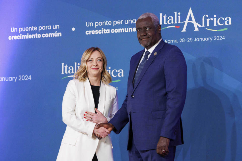 Italian Premier Giorgia Meloni, left, welcomes African Union Commission Chairperson Moussa Faki Mahamat ahead of an Italy - Africa summit, in Rome, Monday, Jan. 29, 2024. Meloni opened a summit of African leaders on Monday aimed at illustrating Italy's big development plan for the continent that her government hopes will stem migration flows and forge a new relationship between Europe and Africa. (Roberto Monaldo/LaPresse via AP)