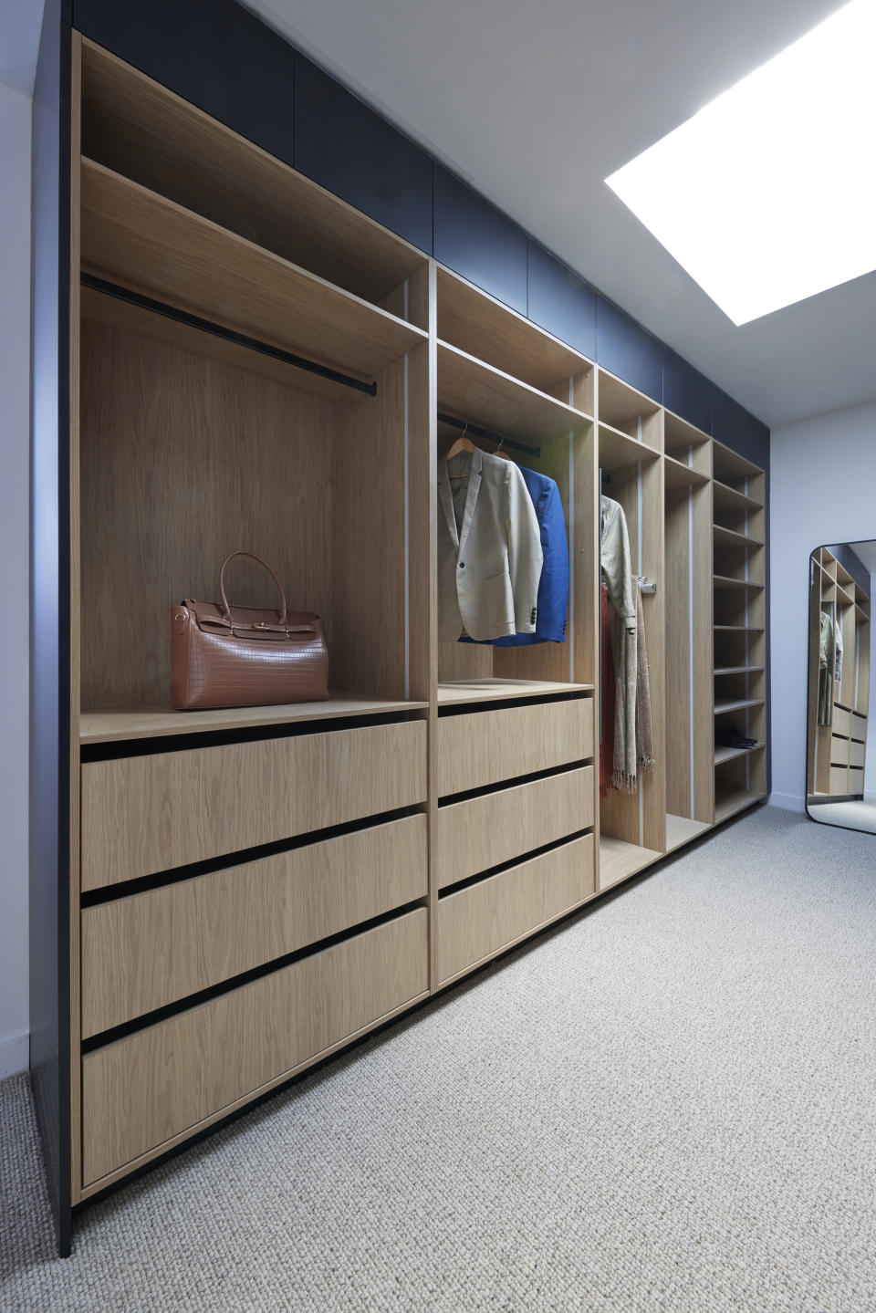 A shot of the shelves and drawers inside the walk-in robe. 