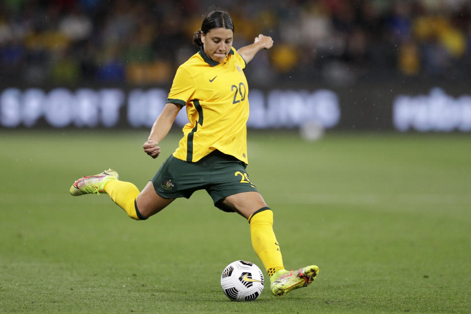 FILE - Australia's Sam Kerr kicks the ball during their friendly soccer match against Brazil in Sydney, Saturday, Oct. 23, 2021. Kerr and Manchester City defender Alanna Kennedy have been recalled to Australia’s squad for two matches against Olympic champion Canada in September that will kick off the Matildas’ final phase of preparations for a World Cup on home soil in 2023. (AP Photo/Rick Rycroft, File)