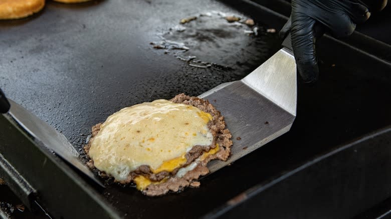 spatula making a smash burger 