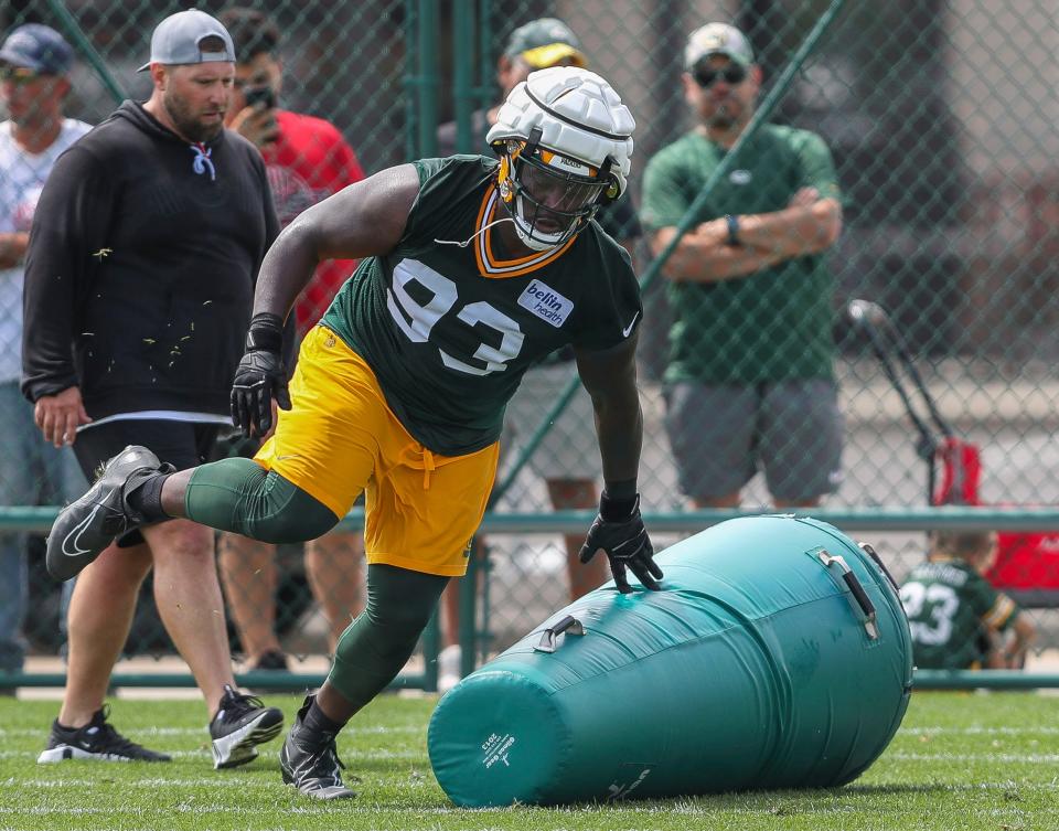 Green Bay Packers defensive tackle T.J. Slaton (93) runs through positional drills during the first day of training camp on Wednesday, July 26, 2023, at Ray Nitschke Field in Green Bay, Wis.Tork Mason/USA TODAY NETWORK-Wisconsin