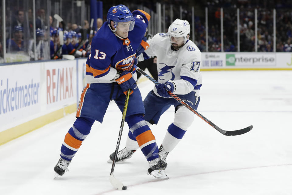 Tampa Bay Lightning's Alex Killorn (17) defends against New York Islanders' Mathew Barzal (13) during the second period of an NHL hockey game Friday, Nov. 1, 2019, in Uniondale, N.Y. (AP Photo/Frank Franklin II)