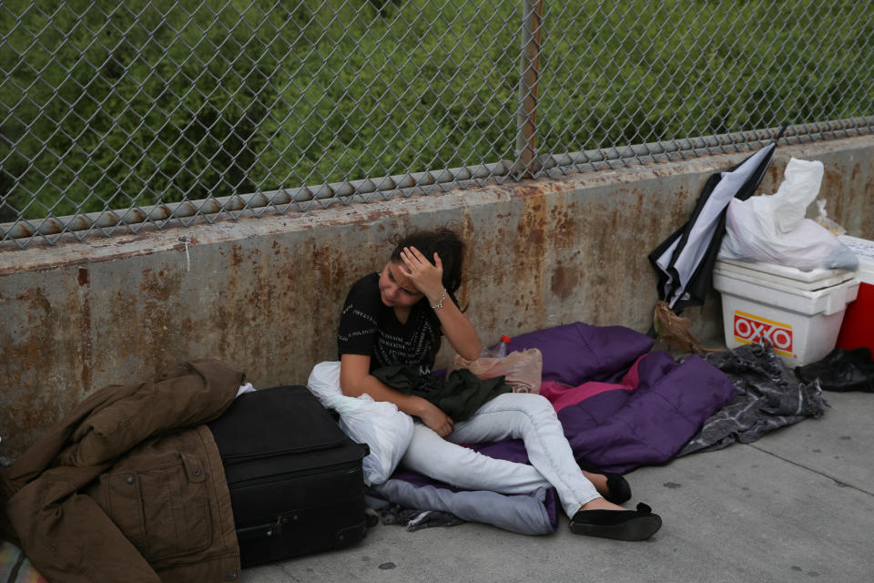 <span class="s1">Aura, 13, an asylum seeker from Guatemala traveling with her father, waits on the Mexican side of the Brownsville-Matamoros International Bridge after being denied entry by ICE on July 25. (Photo: Loren Elliott/Reuters)</span>