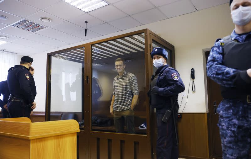 Russian opposition leader Alexei Navalny hearing to consider an appeal against an earlier court decision to change his suspended sentence to a real prison term