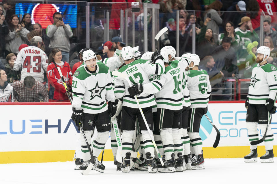 The Dallas Stars celebrate after their victory over the Washington Capitals in an overtime shootout, Thursday, Dec. 7, 2023, in Washington. (AP Photo/Stephanie Scarbrough)