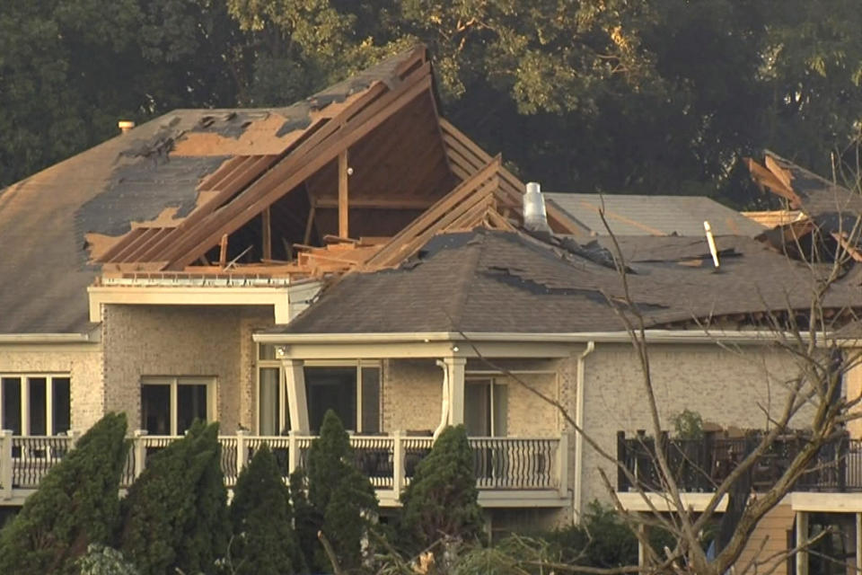 In this image taken from video, a roof of a home is severely damaged after a tornado touched down on Sunday, June 25, 2023, in Johnson County, Ind. Authorities said up to 75 homes were damaged. (WRTV via AP)