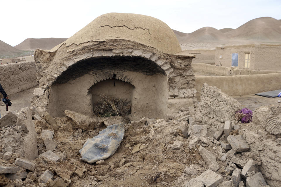 A damaged house is seen after Monday's earthquake in the remote western province of Badghis, Afghanistan, Tuesday, Jan. 18, 2022. The United Nations on Tuesday raised the death toll from Monday's twin earthquakes in western Afghanistan, saying three villages of around 800 houses were flattened by the temblors. (Abdul Raziq Saddiqi)