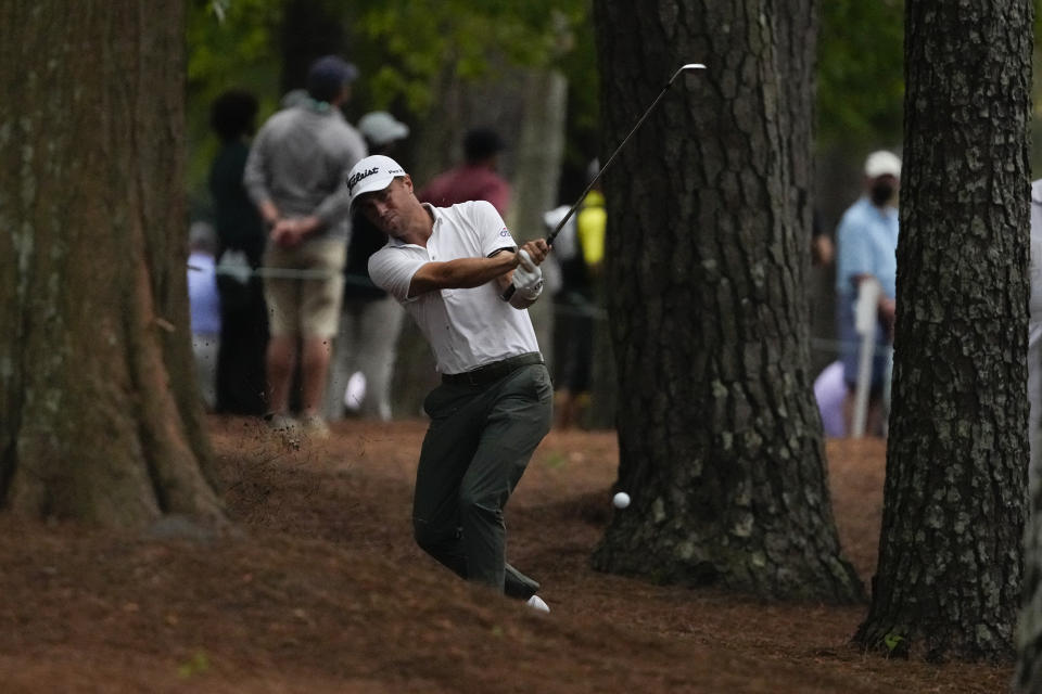 Justin Thomas hits out of the rough on the 13th hole during the third round of the Masters golf tournament on Saturday, April 10, 2021, in Augusta, Ga. (AP Photo/Charlie Riedel)