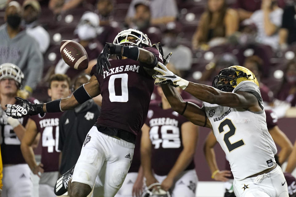 Texas A&M's Myles Jones (0) breaks up a pass intended for Vanderbilt's Amir Abdur-Rahman (2) during the second half of an NCAA college football game Saturday, Sept. 26, 2020, in College Station, Texas. Texas A&M won 17-12. (AP Photo/David J. Phillip)