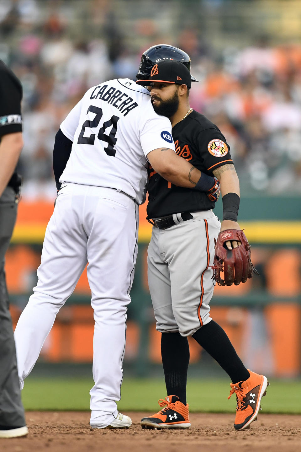 Detroit Tigers' Miguel Cabrera, left, is congratulated by Baltimore Orioles second baseman Rougned Odor after Cabrera hit a double, the 602nd of his career, during the third inning of a baseball game Friday, May 13, 2022, in Detroit. Cabrera passed Barry Bonds for 17th place. (AP Photo/Jose Juarez)