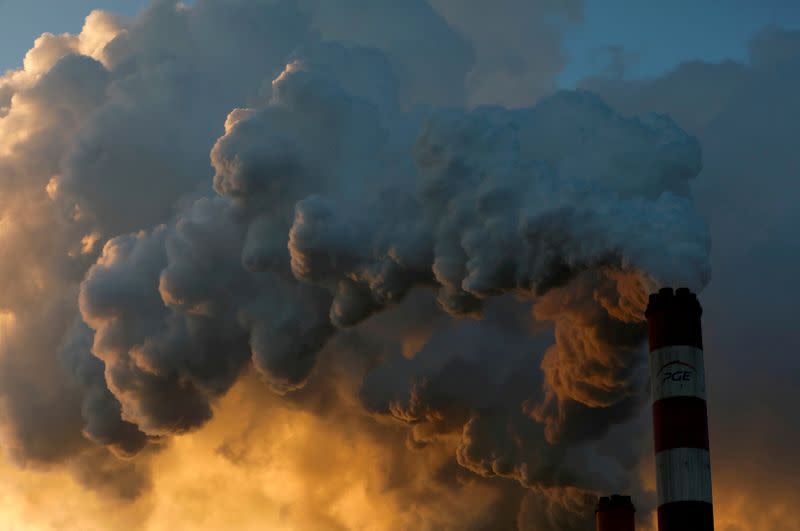 FILE PHOTO: Smoke and steam billow from Belchatow Power Station, Europe's largest coal-fired power plant operated by PGE Group, near Belchatow