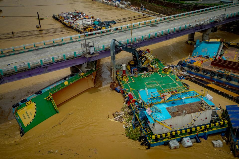 In an aerial view, barges that crashed into a bridge during the onslaught of Typhoon Gaemi (Getty Images)