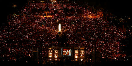 FILE PHOTO: A screen displays an image of the late former Chinese Premier Zhao Ziyang speaking to students in 1989 as tens of thousands of people take part in a candlelight vigil at Hong Kong's Victoria Park June 4, 2009 to mark the 20th anniversary of the crackdown on the pro-democracy movement in Beijing's Tiananmen Square in 1989. REUTERS/Bobby Yip/File Photo