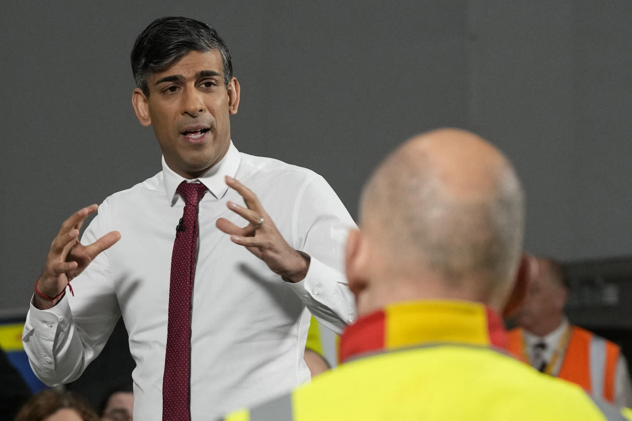 Britain's Prime Minister Rishi Sunak gestures as he speaks to employees during a visit to the DHL Gateway port facility at Stanford Le Hope on the Thames estuary east of London on April 29, 2024. (Photo by Frank Augstein / POOL / AFP) (Photo by FRANK AUGSTEIN/POOL/AFP via Getty Images)
