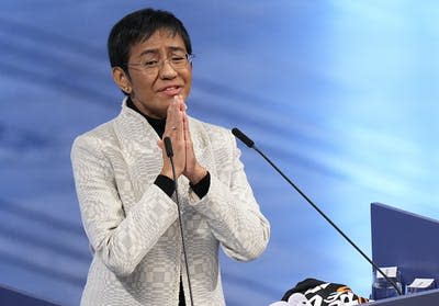 Maria Ressa of the Philippines gestures as she speaks during the Nobel Peace Prize ceremony at Oslo City Hall in Norway in December 2021. (AP Photo/Alexander Zemlianichenko)