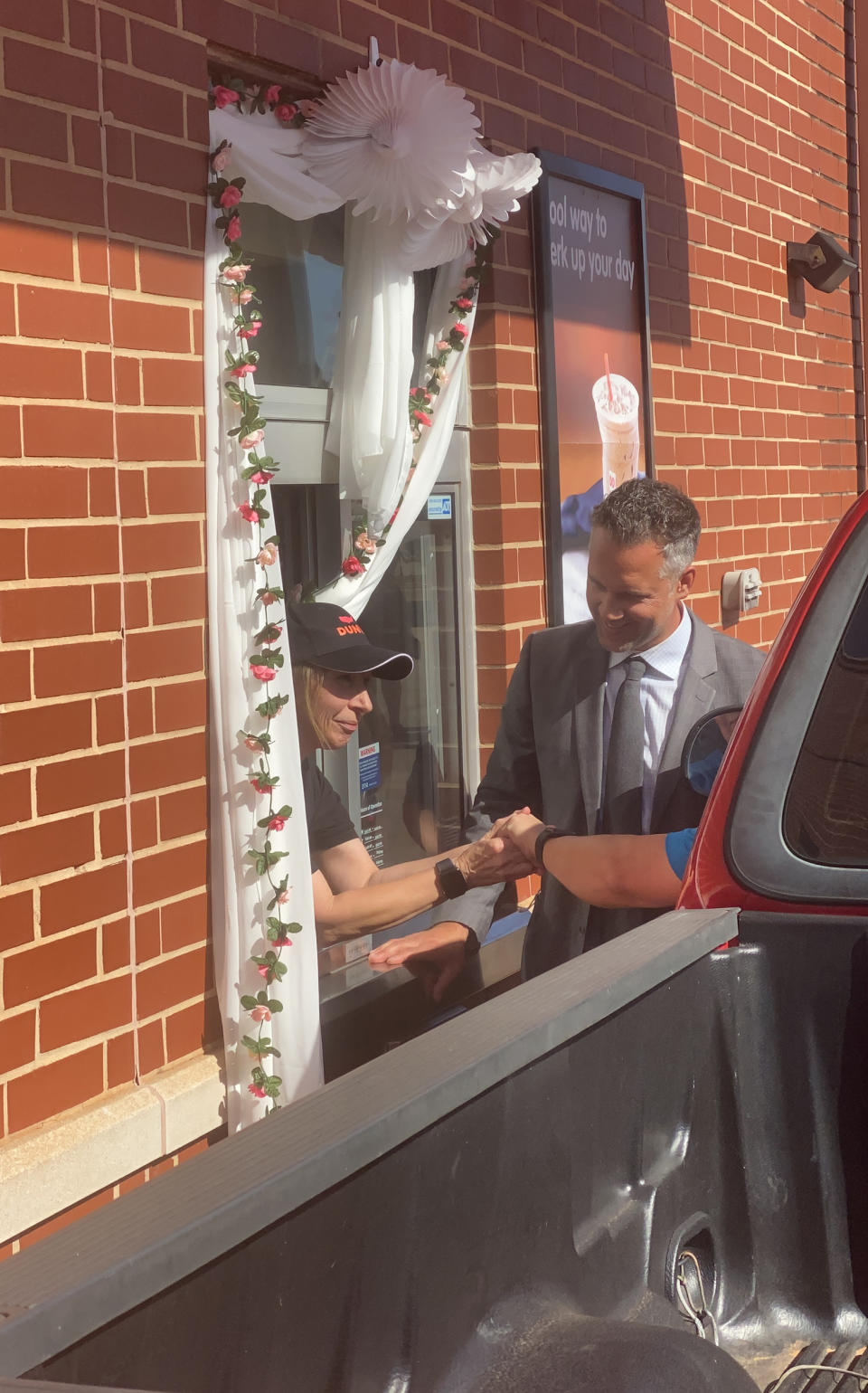 Sugar Good and John Thompson wed this month in the very place they first met: the Dunkin' drive-thru. (Courtesy Jillian Gallagher and Emma Burke)
