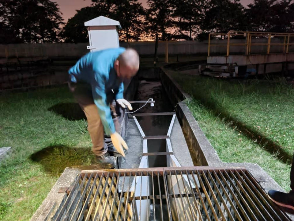 Personnel collecting samples from a residential area storm drain, during the department&#x002019;s investigation into the cause of the dead fishes along Sungai Damansara. &#x002014; Picture courtesy of Selangor Department of Environment