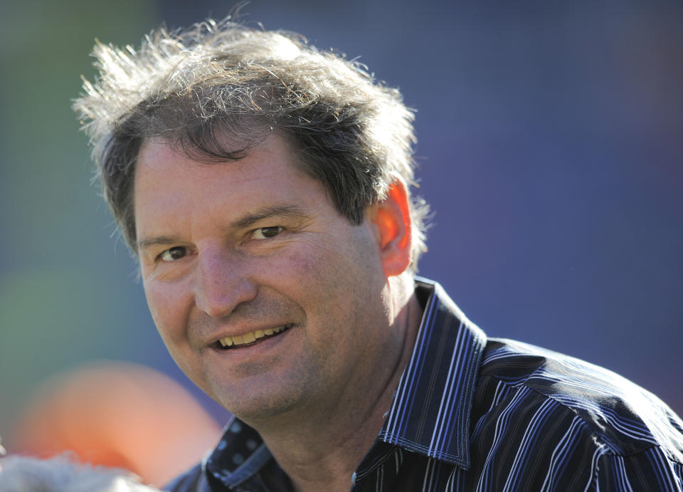 FILE - In this Dec. 23, 2012 file photo, former Cleveland Browns quarterback Bernie Kosar stands on the sideline before of an NFL football game between the Browns and Denver Broncos, in Denver. Kosar believes he's been unfairly sacked as a TV broadcaster. Kosar contends he's been removed because of slurred speech he attributes to "a direct result of the many concussions I received while playing in the NFL." (AP Photo/Jack Dempsey, File)