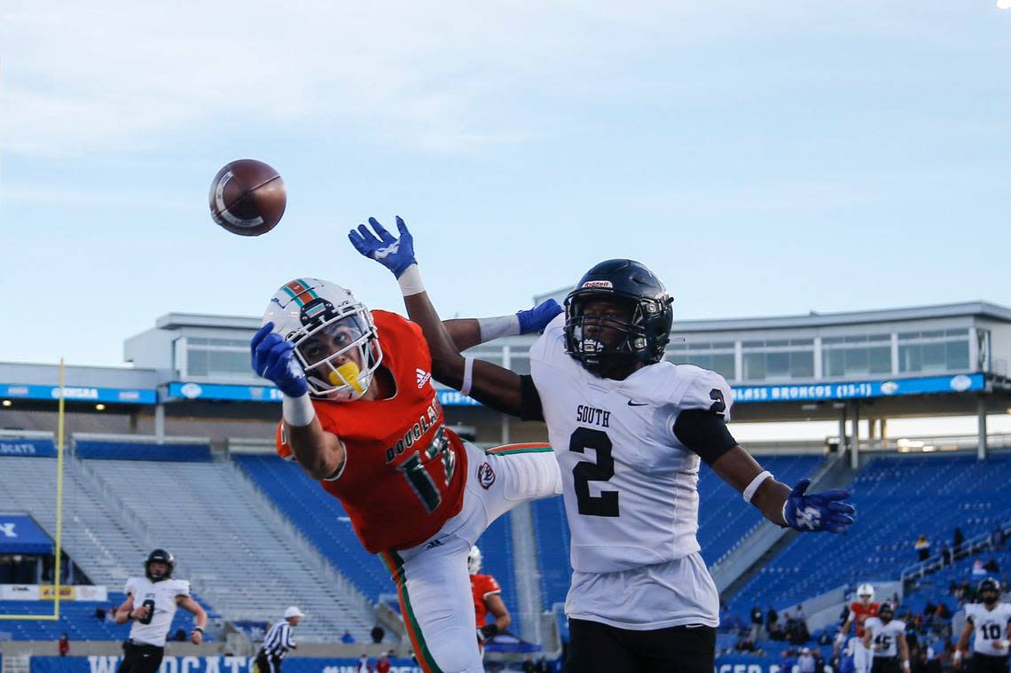 South Warren defensive back Cristian Conyer (2) and Frederick Douglass wide receiver Dane Key (12) squared off during last year’s Class 5A state championship game at Kroger Field in Lexington. Key is now a freshman at UK. Conyer has committed to Tennessee.