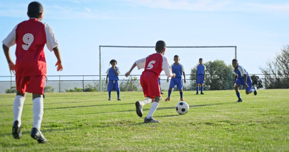 Young boys playing in a soccer game