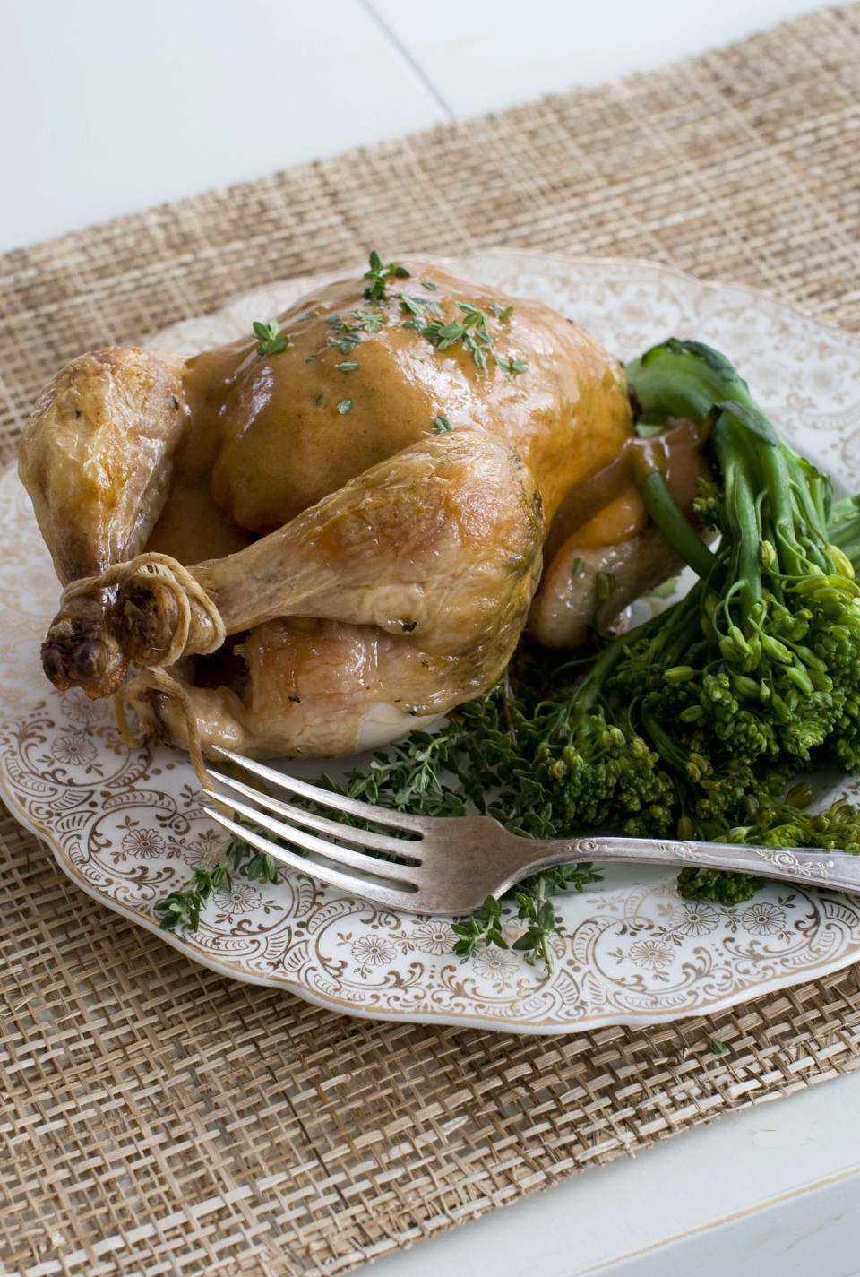 In this image taken on November 5, 2012, a herb roasted Cornish game hen with creamy mustard sauce is shown served on a plate in Concord, N.H. (AP Photo/Matthew Mead)