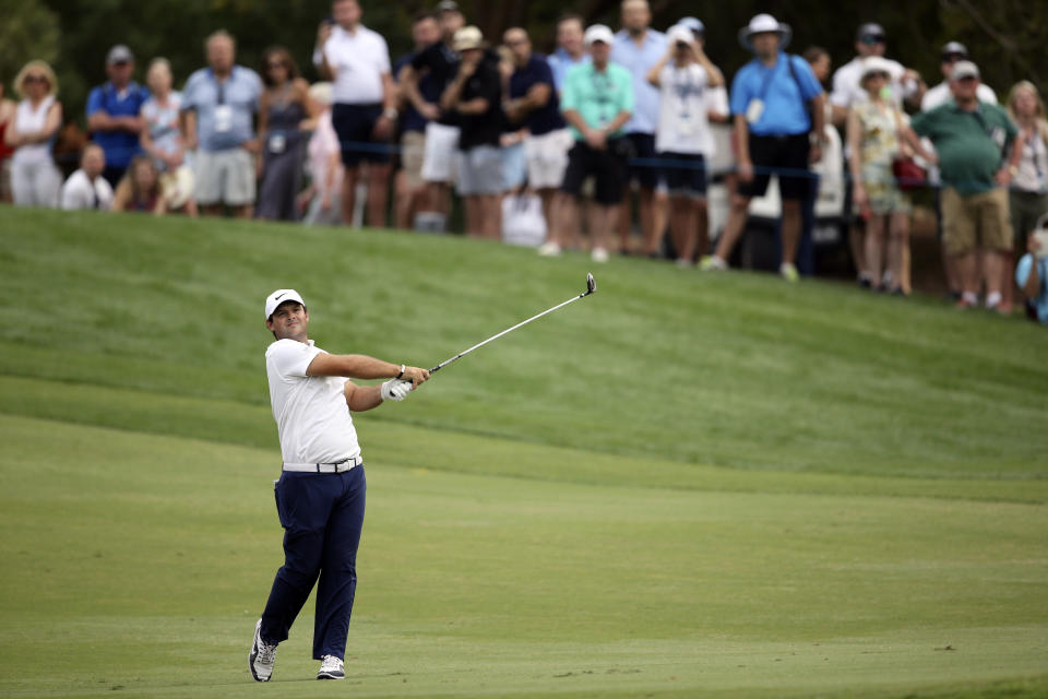 Patrick Reed from the U.S. plays a shot on the 18th hole during the third round of the DP World Tour Championship golf tournament in Dubai, United Arab Emirates, Saturday, Nov. 17, 2018. (AP Photo/Kamran Jebreili)