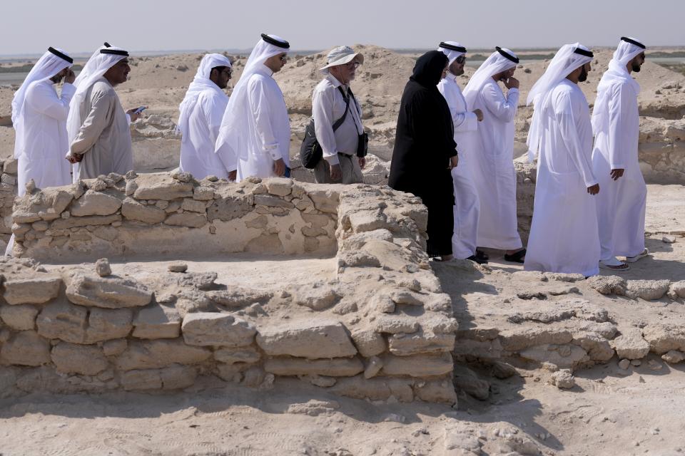 Emirati officials visit an ancient Christian monastery on Siniyah Island in Umm al-Quwain, United Arab Emirates, Thursday, Nov. 3, 2022. The monastery possibly dating as far back as the years before Islam rose across the Arabian Peninsula has been discovered on an island off the coast of the UAE officials announced Thursday, Nov. 3, 2022. (AP Photo/Kamran Jebreili)