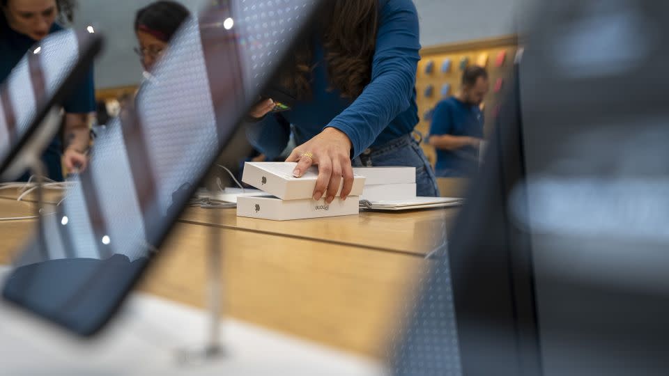 A customer purchases an iPhone 15 on September 22, 2023 in Milan, Italy. - Ming Yeung/Getty Images