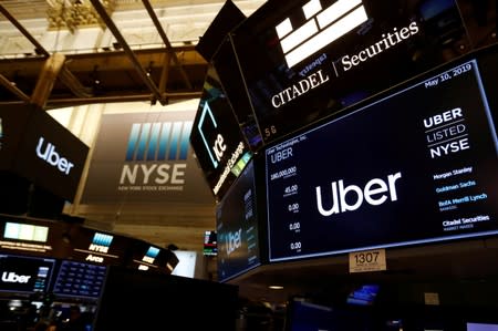 FILE PHOTO: Screens display Uber Technologies Inc. logo during the company's IPO at the NYSE in New York