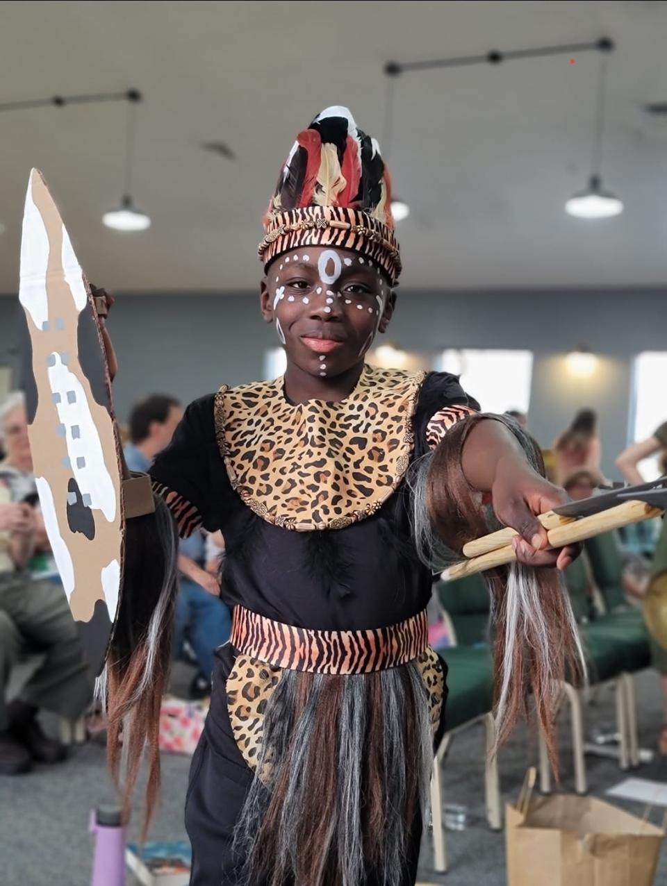 Oshkosh's Emmanuel Che-Kika shows off his Shaka, a historic Zulu king and conqueror, costume. The creative costume is a product of Emmanuel's dad's craftmanship.