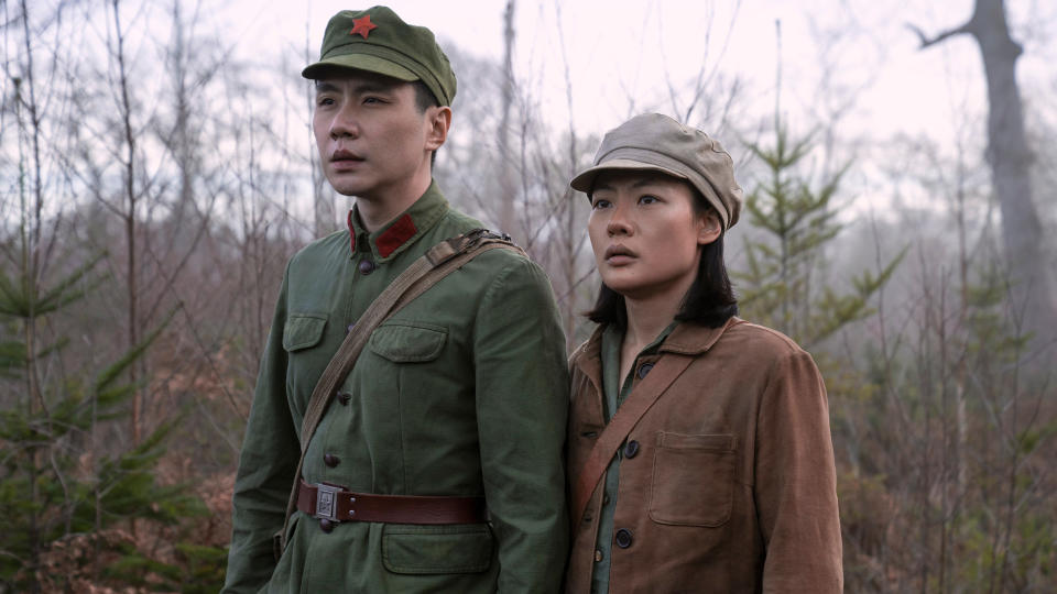 A Chinese soldier and Ye Wenjie stand in a field in Netflix's 3 Body Problem TV series