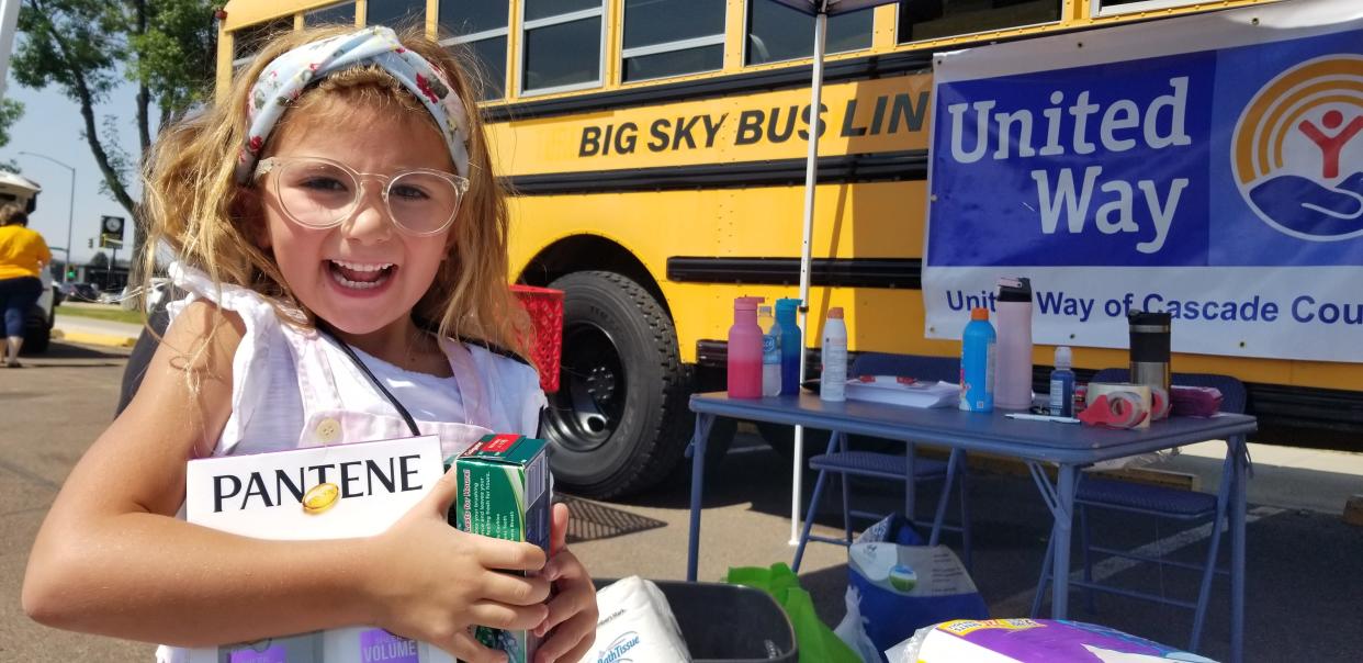 A Great Falls elementary school student celebrates the generosity of Great Falls donors. United Way volunteers are collecting school supplies Thursday at Target and both Walmarts from 8 am to 5:30 pm as part of its 14th annual Stuff the Bus.