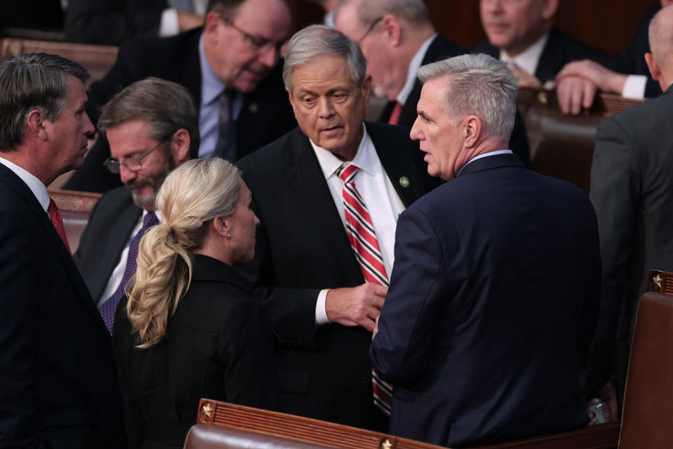 From right to left, U.S. House Republican leader Kevin McCarthy (R-CA), Rep.-elect Ralph Norman (R-SC), and Rep.-elect Majorie Taylor Greene (R-GA) talk in the House Chambe