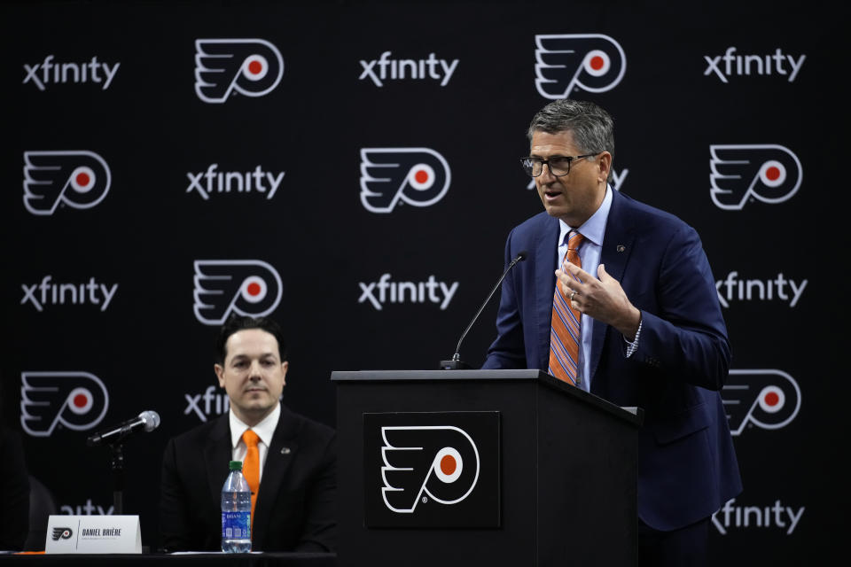 Keith Jones, right, Philadelphia Flyers President of Hockey Operations, speaks during a news conference at the NHL hockey team's arena, Friday, May 12, 2023, in Philadelphia. (AP Photo/Matt Slocum)