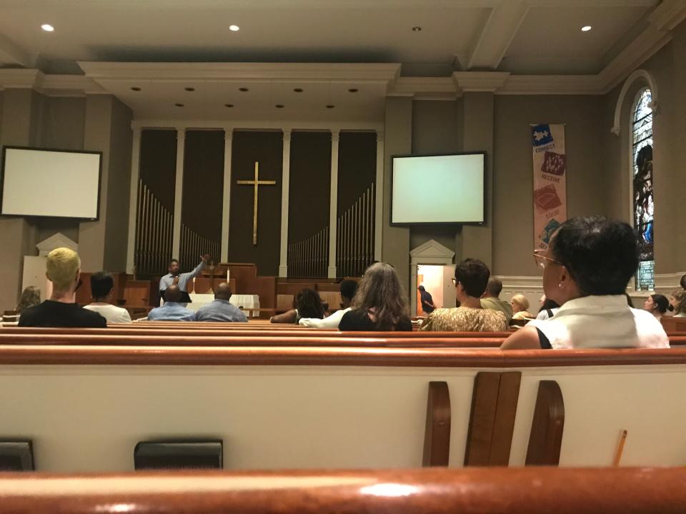 McKendree UMC Pastor Stephen Handy speaks before the "No Vacancy" screening at his church.