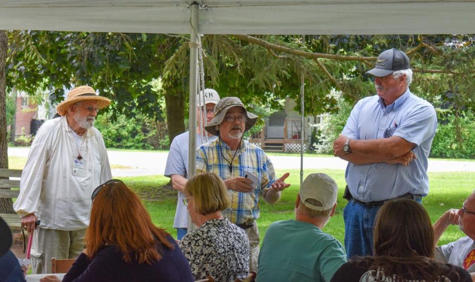 Ottawa County Historical Society President Patrick Lawrence O’Keeffe, center, talks about the history of the Keeper’s House to members of the Wolcott family. On the left is retired Ottawa County Judge Paul Moon.